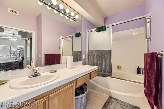 2110 Los Feliz St Unit 1066, Las Vegas, NV 89156 - bathroom with vanity, bath / shower combo with glass door, ceiling fan, and tile patterned flooring