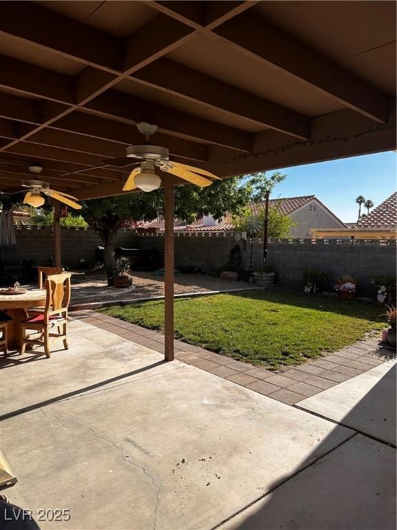 5020 Wildroot Rd, Las Vegas, NV 89130 - fenced backyard with ceiling fan, a patio, and outdoor dining area
