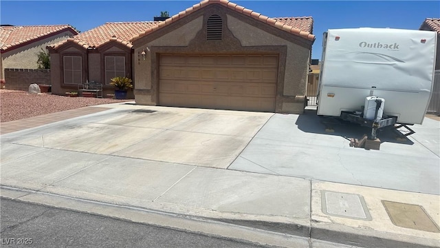 5020 Wildroot Rd, Las Vegas, NV 89130 - view of front of house featuring stucco siding, a tile roof, and driveway
