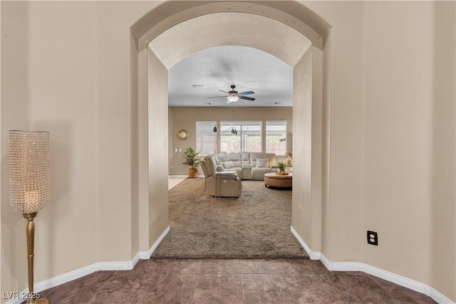 9362 Wilderness Glen Ave, Las Vegas, NV 89178 - corridor featuring arched walkways, carpet floors, and baseboards