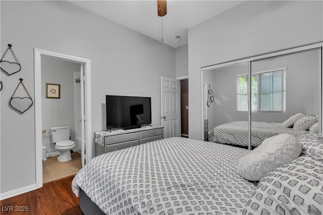 9362 Wilderness Glen Ave, Las Vegas, NV 89178 - bedroom with a closet, dark wood-style floors, baseboards, ensuite bath, and a ceiling fan