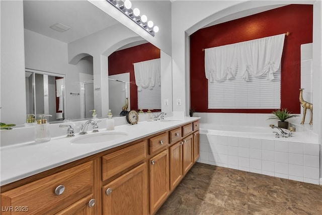 9362 Wilderness Glen Ave, Las Vegas, NV 89178 - full bath with double vanity, a stall shower, and a garden tub