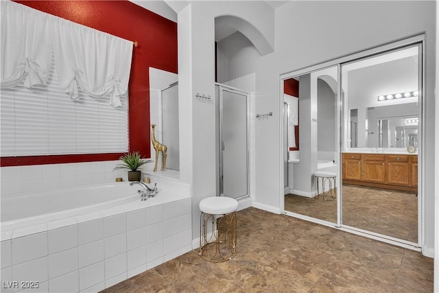 9362 Wilderness Glen Ave, Las Vegas, NV 89178 - bathroom with a bath, a stall shower, and vanity