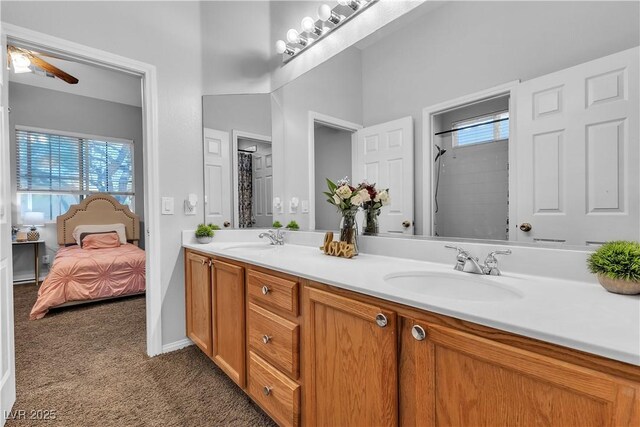 9362 Wilderness Glen Ave, Las Vegas, NV 89178 - full bath featuring double vanity, a ceiling fan, a shower, ensuite bath, and baseboards
