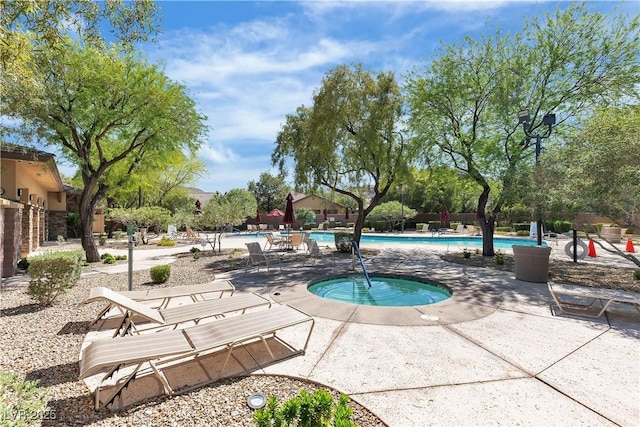 9362 Wilderness Glen Ave, Las Vegas, NV 89178 - community pool with a hot tub and a patio