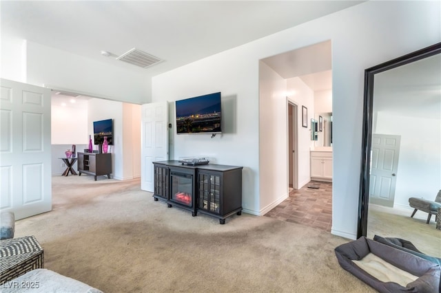 7107 Calvert Cliffs St, North Las Vegas, NV 89084 - carpeted living area featuring baseboards
