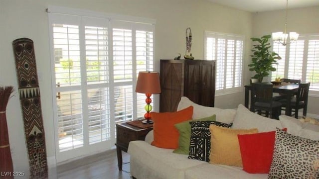 4821 Black Bear Rd Unit 104, Las Vegas, NV 89149 - living area featuring a chandelier and wood finished floors