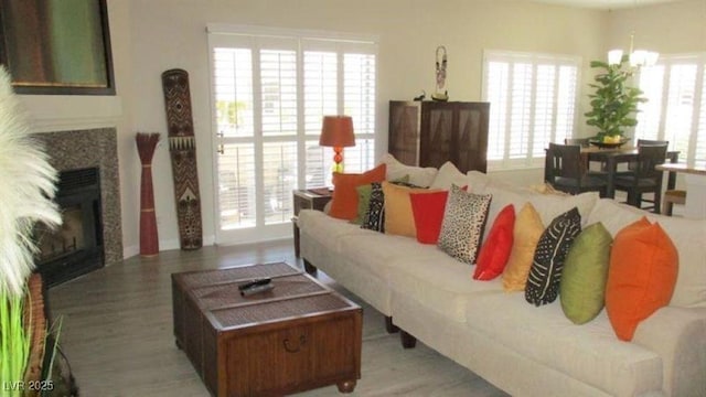 4821 Black Bear Rd Unit 104, Las Vegas, NV 89149 - living area with wood finished floors and a glass covered fireplace