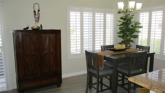 4821 Black Bear Rd Unit 104, Las Vegas, NV 89149 - dining space with a chandelier, baseboards, and plenty of natural light