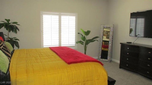 4821 Black Bear Rd Unit 104, Las Vegas, NV 89149 - bedroom featuring multiple windows, carpet, and baseboards