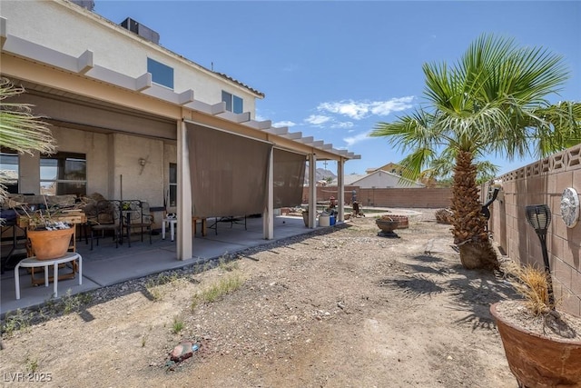 2147 Bridle Wreath Ln, Las Vegas, NV 89156 - fenced backyard featuring a fire pit and a patio area
