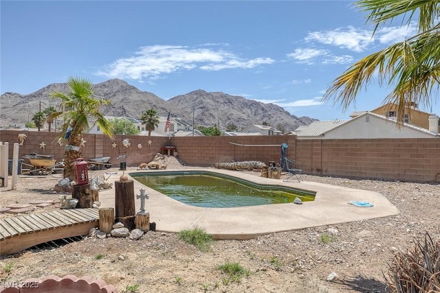 2147 Bridle Wreath Ln, Las Vegas, NV 89156 - view of swimming pool featuring a mountain view, a fenced backyard, and a patio area