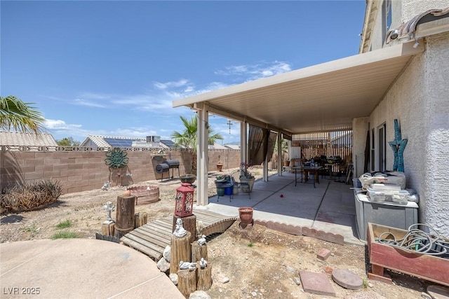 2147 Bridle Wreath Ln, Las Vegas, NV 89156 - fenced backyard with a patio area and a fire pit