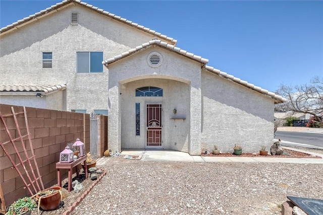 2147 Bridle Wreath Ln, Las Vegas, NV 89156 - view of exterior entry with stucco siding and a tiled roof