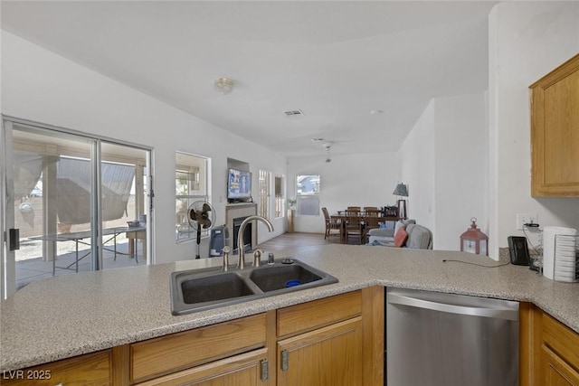 2147 Bridle Wreath Ln, Las Vegas, NV 89156 - kitchen featuring dishwasher, a sink, light countertops, and open floor plan