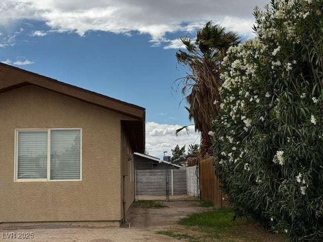 4189 Studio St, Las Vegas, NV 89115 - view of home's exterior featuring fence and stucco siding