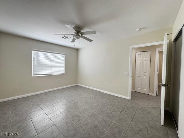 4189 Studio St, Las Vegas, NV 89115 - tiled empty room featuring ceiling fan and baseboards