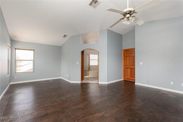 1924 Coralino Dr, Henderson, NV 89074 - spare room featuring arched walkways, lofted ceiling, a ceiling fan, hardwood / wood-style floors, and baseboards