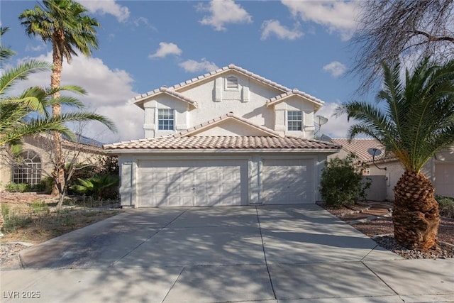 1924 Coralino Dr, Henderson, NV 89074 - mediterranean / spanish house with concrete driveway, a garage, a tile roof, and stucco siding