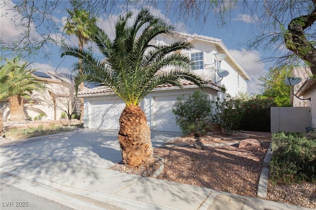 1924 Coralino Dr, Henderson, NV 89074 - view of front facade featuring a garage, concrete driveway, and stucco siding