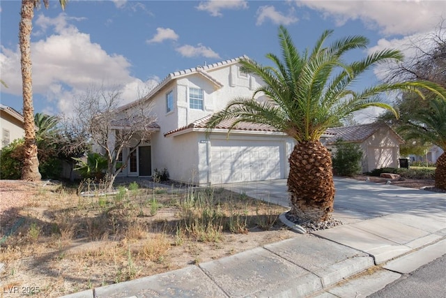 1924 Coralino Dr, Henderson, NV 89074 - view of front of home featuring driveway, stucco siding, and a garage