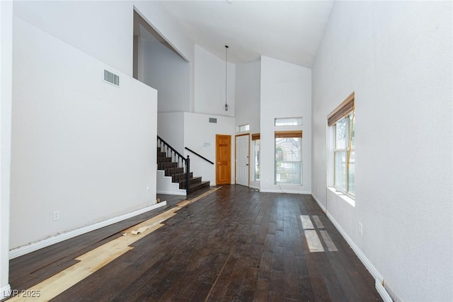 1924 Coralino Dr, Henderson, NV 89074 - entryway featuring high vaulted ceiling, stairs, hardwood / wood-style flooring, and baseboards