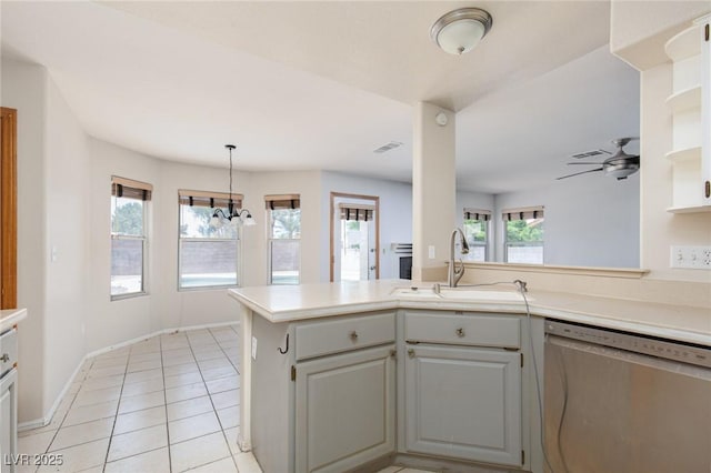 1924 Coralino Dr, Henderson, NV 89074 - kitchen featuring dishwasher, a sink, light countertops, light tile patterned floors, and open shelves