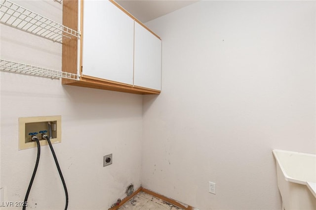 1924 Coralino Dr, Henderson, NV 89074 - laundry area featuring cabinet space, electric dryer hookup, washer hookup, and baseboards