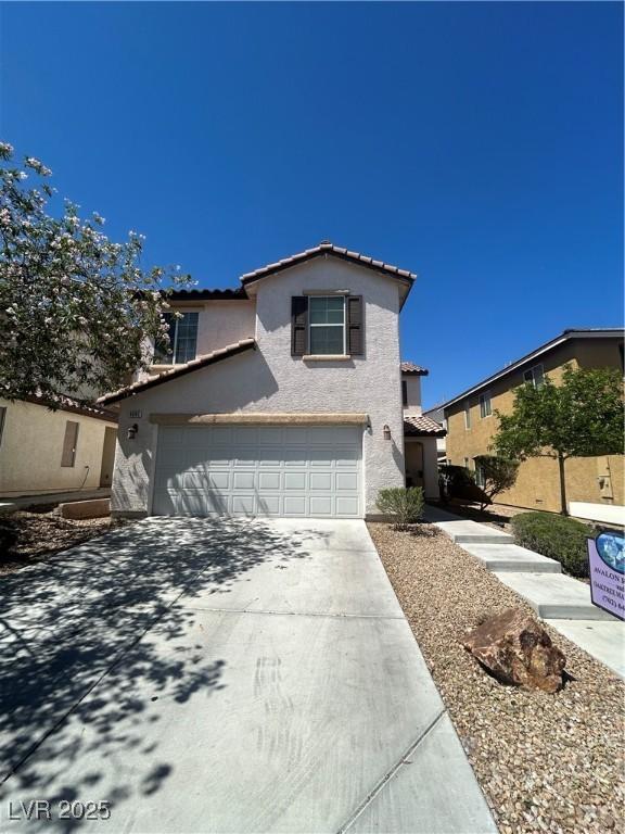 9082 Amanda Creek Ct, Las Vegas, NV 89149 - traditional-style home with stucco siding, driveway, a garage, and a tiled roof