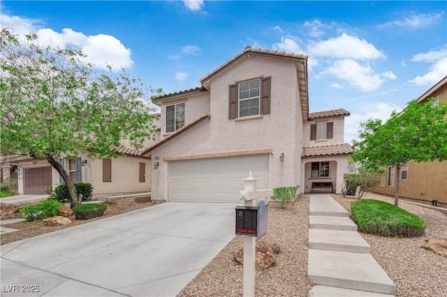 9082 Amanda Creek Ct, Las Vegas, NV 89149 - mediterranean / spanish home featuring a tile roof, stucco siding, concrete driveway, and a garage