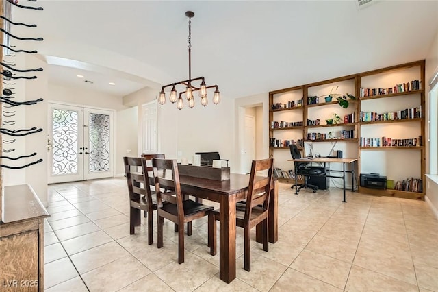 7404 Eggshell Dr, North Las Vegas, NV 89084 - dining area featuring light tile patterned flooring, french doors, and a chandelier