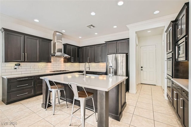 7404 Eggshell Dr, North Las Vegas, NV 89084 - kitchen featuring wall chimney range hood, a sink, light tile patterned flooring, appliances with stainless steel finishes, and crown molding