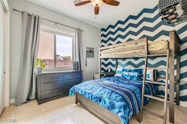 7404 Eggshell Dr, North Las Vegas, NV 89084 - bedroom featuring light tile patterned flooring, ceiling fan, and an accent wall