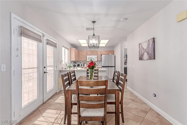 7912 Horn Beam Ct, Las Vegas, NV 89131 - dining room featuring light tile patterned floors and baseboards