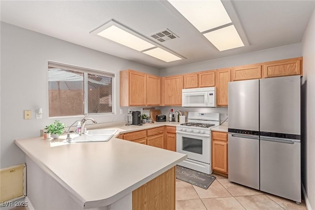 7912 Horn Beam Ct, Las Vegas, NV 89131 - kitchen featuring white appliances, a sink, a peninsula, light countertops, and light brown cabinets