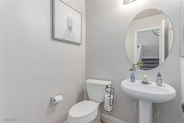 7912 Horn Beam Ct, Las Vegas, NV 89131 - half bath featuring baseboards and toilet