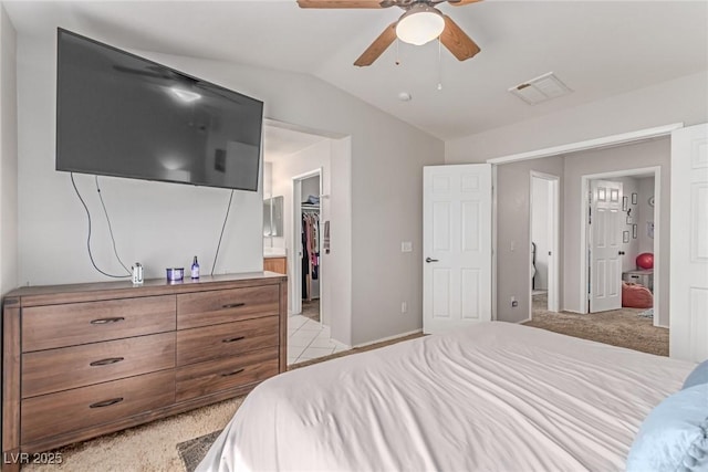 7912 Horn Beam Ct, Las Vegas, NV 89131 - bedroom featuring lofted ceiling, a spacious closet, connected bathroom, ceiling fan, and a closet