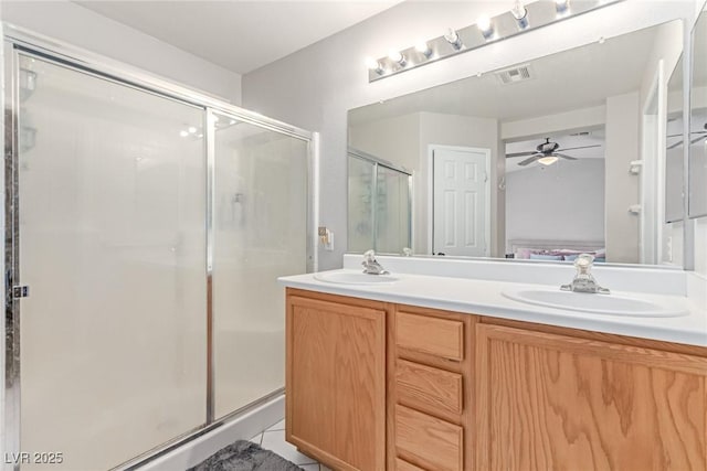 7912 Horn Beam Ct, Las Vegas, NV 89131 - ensuite bathroom featuring a ceiling fan, a shower stall, and double vanity
