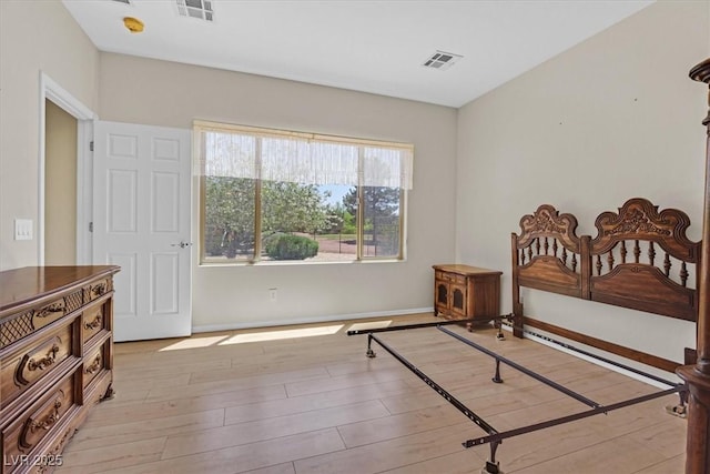 6039 Tokara Ave, Las Vegas, NV 89122 - bedroom with light wood-type flooring and baseboards