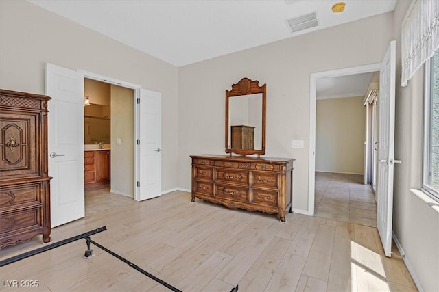 6039 Tokara Ave, Las Vegas, NV 89122 - bedroom featuring light wood-style flooring and baseboards