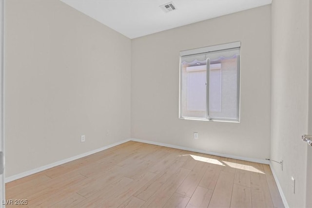 6039 Tokara Ave, Las Vegas, NV 89122 - spare room with wood finished floors and baseboards