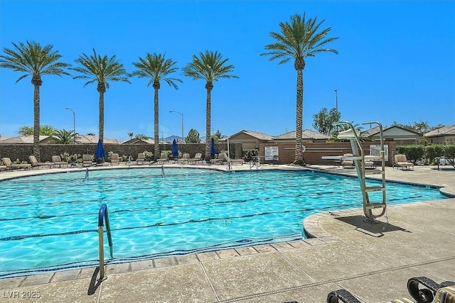 6039 Tokara Ave, Las Vegas, NV 89122 - community pool with a patio area
