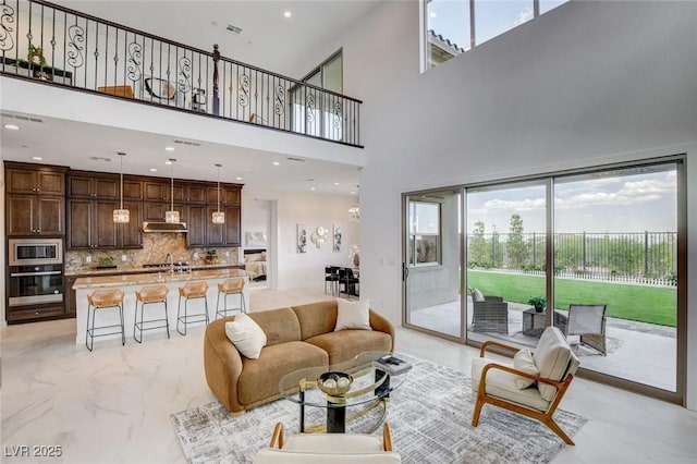 350 Gandara St, Las Vegas, NV 89138 - living area with a towering ceiling, light marble finish floors, and recessed lighting