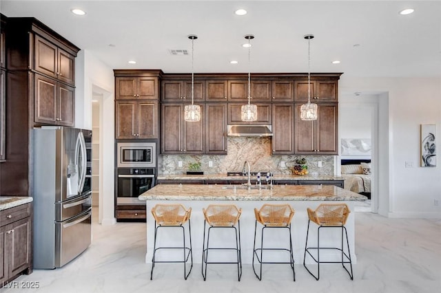 350 Gandara St, Las Vegas, NV 89138 - kitchen with stainless steel appliances, under cabinet range hood, a sink, recessed lighting, and backsplash