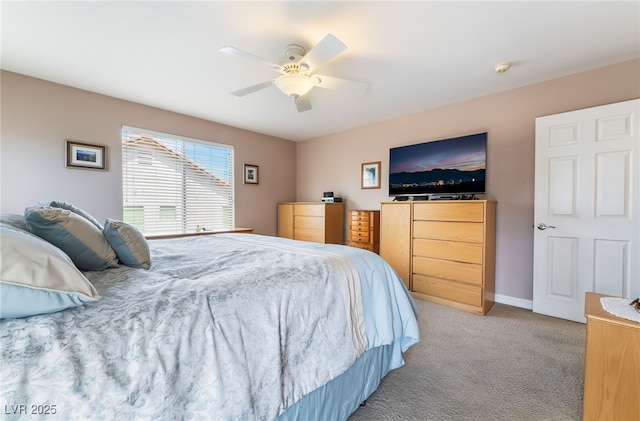 bedroom featuring carpet flooring, a ceiling fan, and baseboards