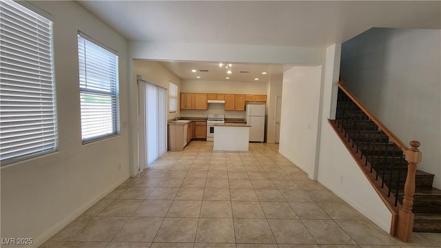 386 Botanic Gardens Dr, Las Vegas, NV 89148 - kitchen with stove, freestanding refrigerator, plenty of natural light, recessed lighting, and light tile patterned floors
