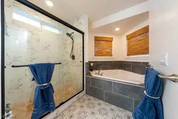 1251 Cavalry St, Pahrump, NV 89048 - bathroom with a marble finish shower, a bath, and recessed lighting