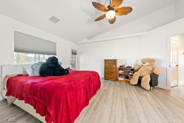 1251 Cavalry St, Pahrump, NV 89048 - bedroom with lofted ceiling, wood finished floors, and ceiling fan