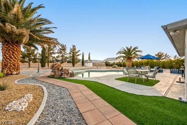 1251 Cavalry St, Pahrump, NV 89048 - swimming pool with a patio area