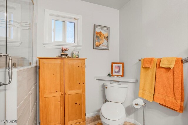 197 Ebb Tide Cir, Las Vegas, NV 89123 - bathroom featuring toilet, a shower, and baseboards